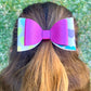 Pink and hearts hair bow in girls hair.