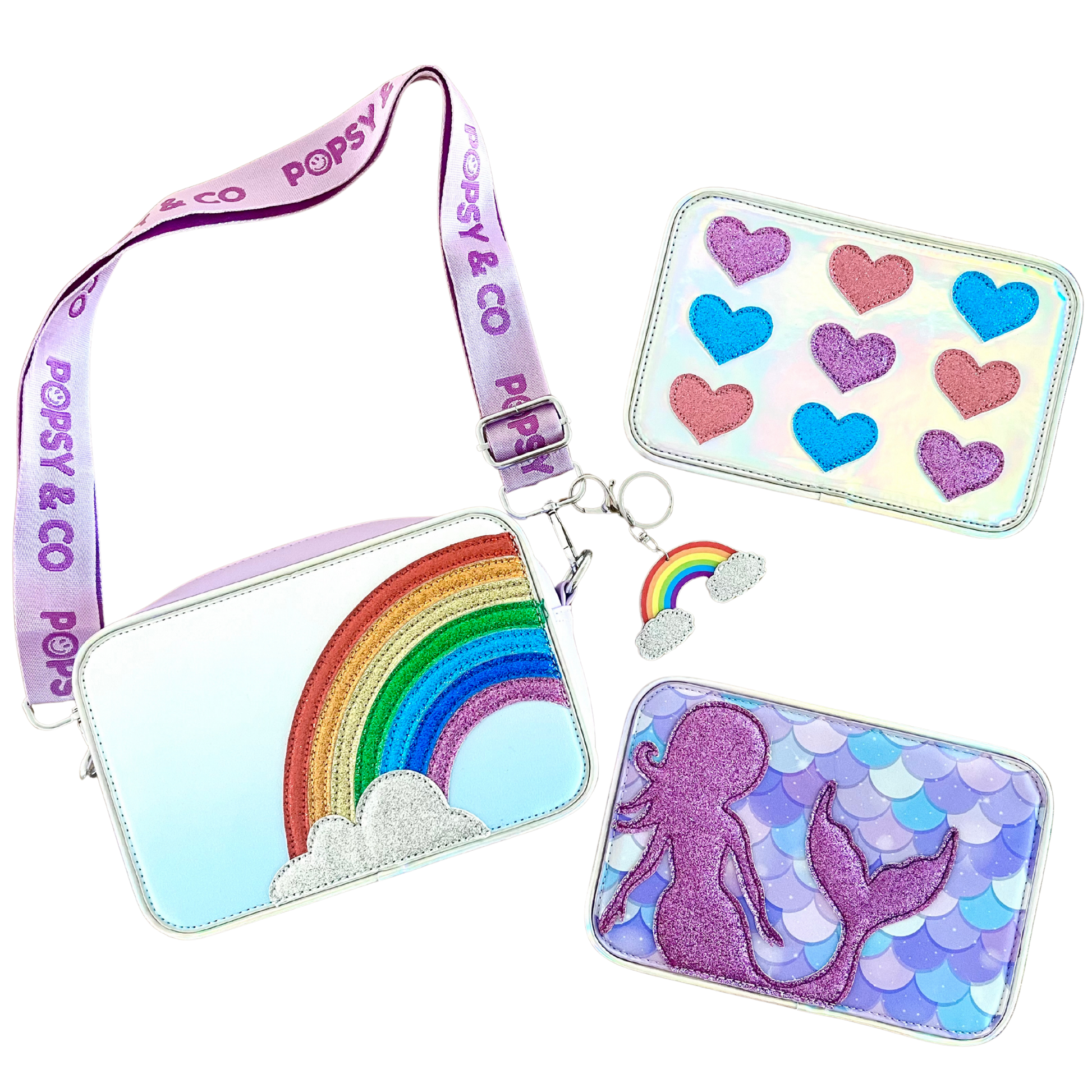 Flat lay of Magic gift set with a rainbow bag, mermaid interchangeable cover, glitter hearts interchangeable cover and rainbow bag charm.