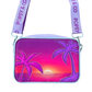 A purple crossbody bag with an interchangeable front cover with a sunset and two palms, one metallic pink and the other metallic purple.