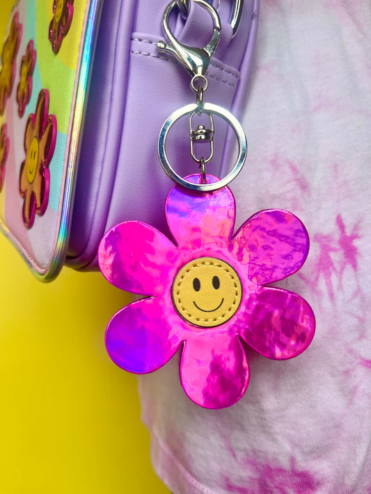 Pink metallic flower smiley keychain. Silver-like clip