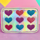 A glitter hearts interchangeable front cover for kids crossbody bag from Popsy and Co. This cover is called Queen of hearts.