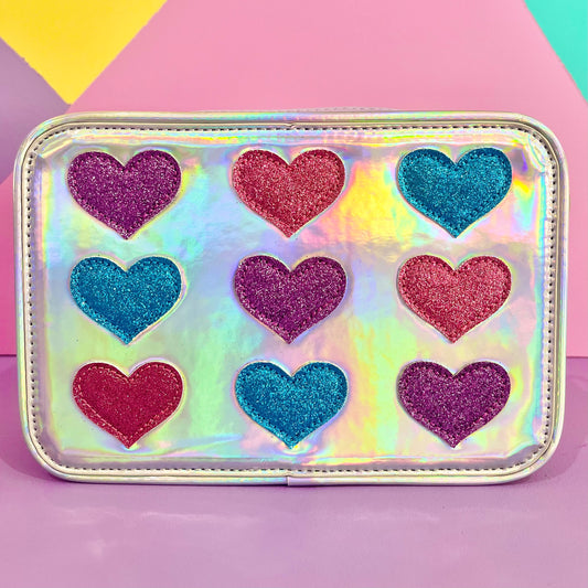 A glitter hearts interchangeable front cover for kids crossbody bag from Popsy and Co. This cover is called Queen of hearts.